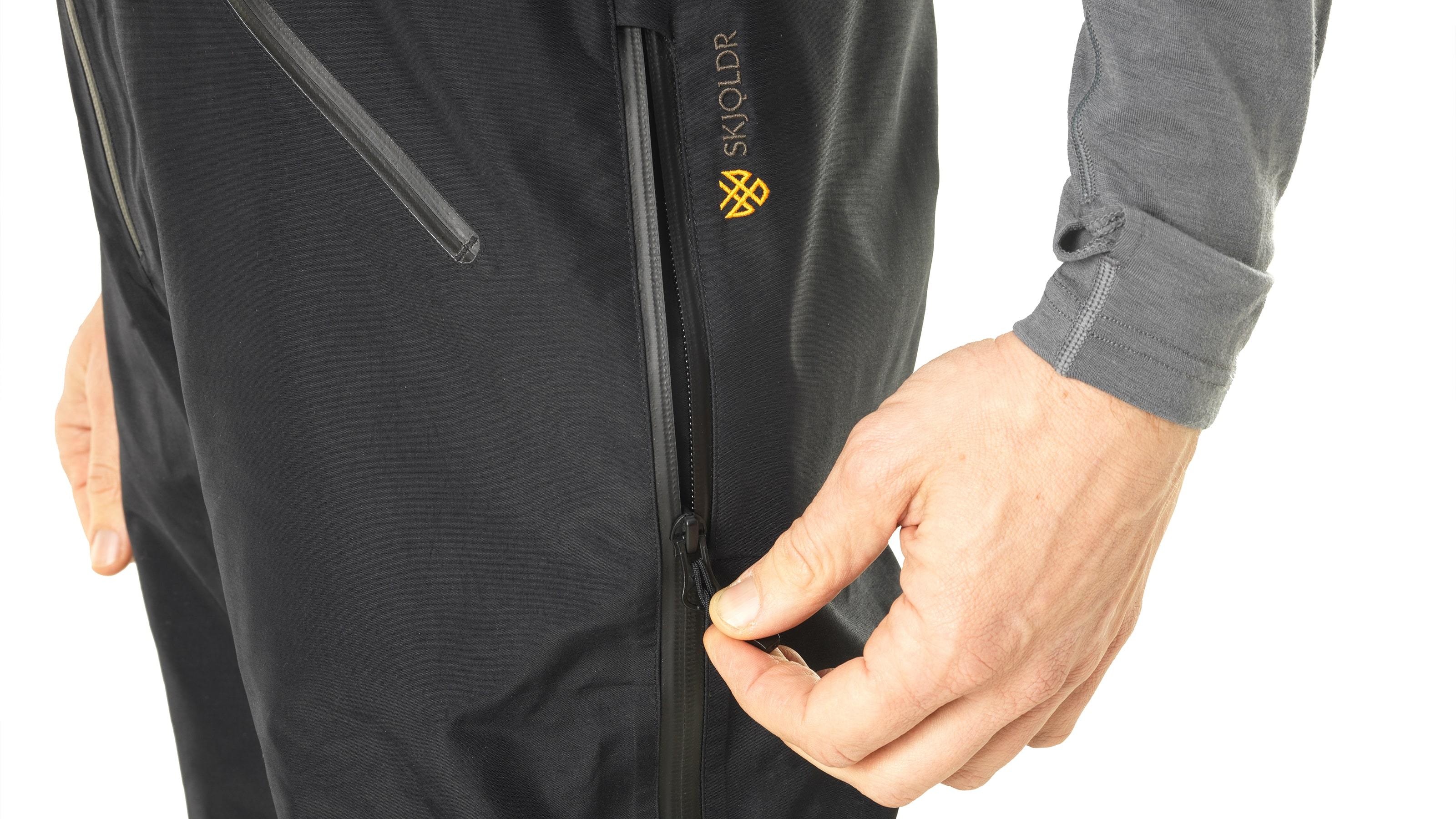 tech:YKK® AquaGuard®3/4 length side zips stop short of harness pressure points. The 2-way zips provide rapid ventilation when needed.